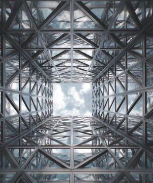 man-in-front-of-building-1024x683-302x362 Home